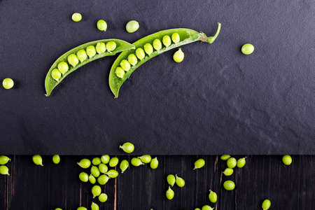 Sugar snap peas with mint on a rustic wood backgroundの写真素材
