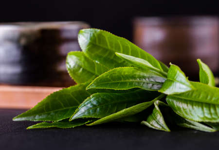 Top view of green tea matcha in a bowl on wooden surfaceの写真素材