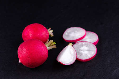 Red fresh radish on wooden