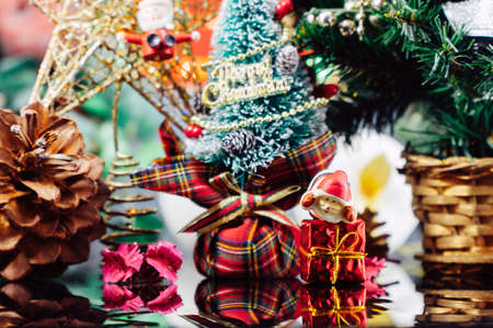 Christmas background with decorations and gift boxes on woodenの写真素材