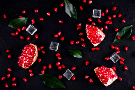 Ripe pomegranate fruits on the wooden background