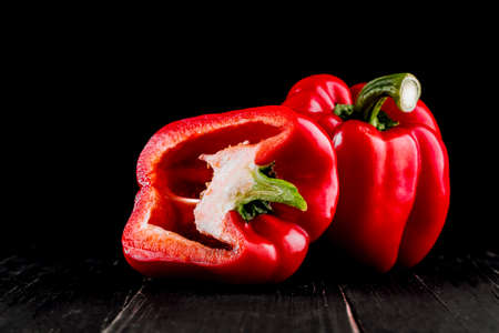 Three sweet peppers on a wooden background, Cooking vegetable salad