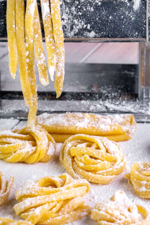 pasta with pasta ingredients on the dark wooden table top view
