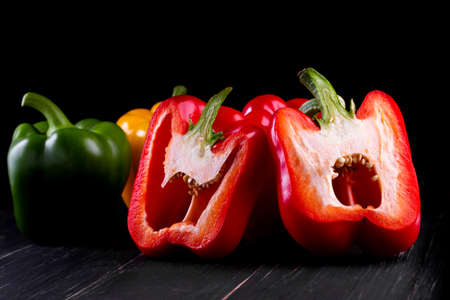 Three sweet peppers on a wooden background, Cooking vegetable saladの写真素材