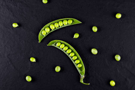 Sugar snap peas with mint on a rustic wood backgroundの写真素材