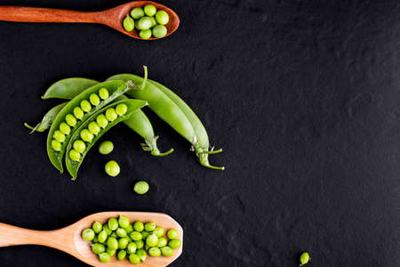 Sugar snap peas with mint on a rustic wood backgroundの写真素材