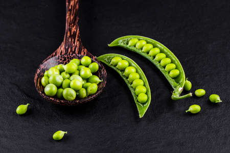 Sugar snap peas with mint on a rustic wood backgroundの写真素材