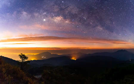Panorama Milky Way Galaxy with light city at Doi inthanon Chiang mai, Thailand