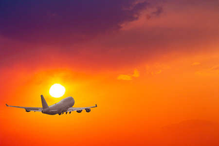 Passenger jet plane in the sky. Airplane flies high above the clouds