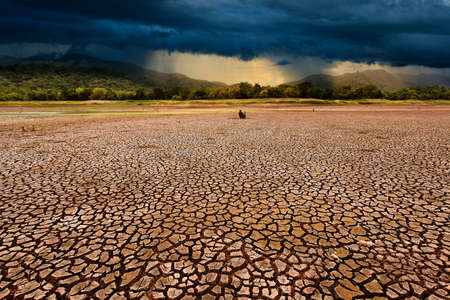 thunder storm sky Rain clouds Cracked dry landの写真素材