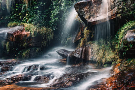 soft water of the stream in the WIMAN THIP Waterfall natural park, Beautiful waterfall in rain...
