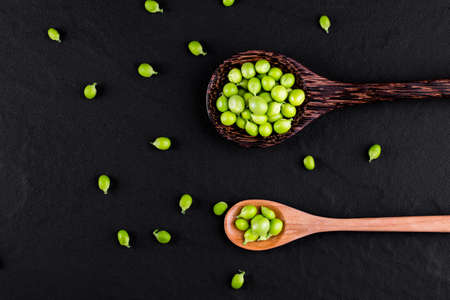 Sugar snap peas with mint on a rustic wood backgroundの写真素材