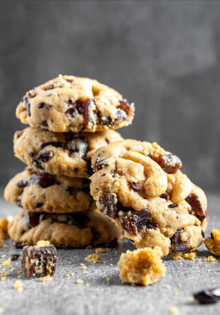 Stack of tasty chocolate cookies on gray tableの写真素材