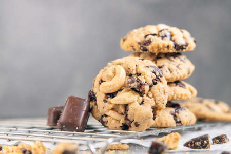 Stack of tasty chocolate cookies on gray tableの写真素材