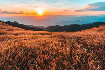 colorful dramatic sky with cloud at sunset in the mountains