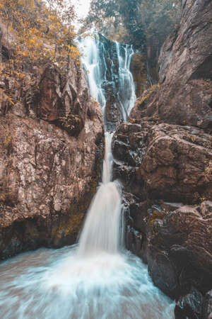 Waterfall colorful leaves in the summer is a beautiful waterfall with clearの写真素材
