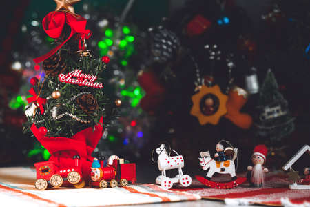 Christmas background with decorations and gift boxes on woodenの写真素材