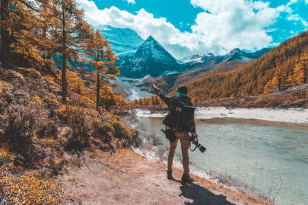 Colorful in autumn forest and snow mountain at Yading nature reserve, The last Shangri laの写真素材