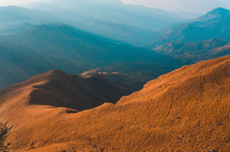 Top View Mulayit Taung golden light of the morning sun and the mist covered on Mount Mulayit,Myanmarの写真素材