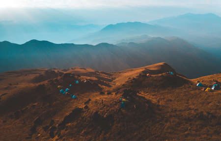 Top View Mulayit Taung golden light of the morning sun and the mist covered on Mount Mulayit,Myanmarの写真素材