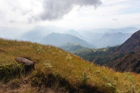 Top View Mulayit Taung golden light of the morning sun and the mist covered on Mount Mulayit,Myanmar