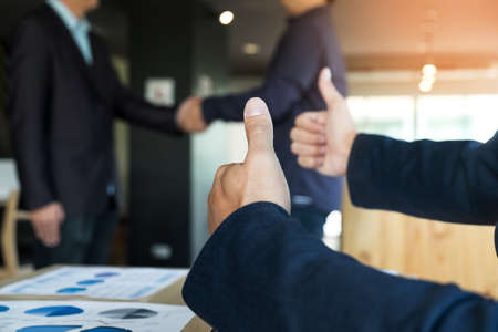 Image of businessmans handshake. Successful businessmen handshaking after good deal.の写真素材