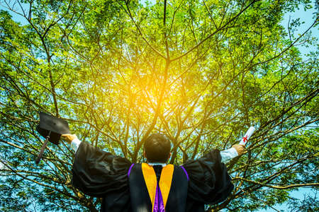 successful graduating student with nature background.の写真素材