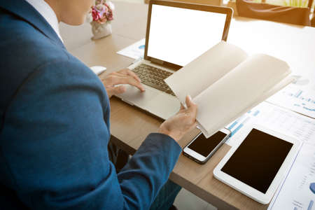 businessman working plan the business and analysis many chart graph.