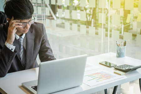 portrait of stressed business man in the office.の写真素材