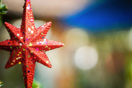 Merry Christmas and Happy Holidays Red star, blurred background.の写真素材