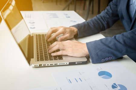 Business adviser analyzing financial figures denoting the progress in work of company, business concept.の写真素材