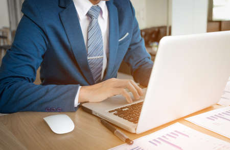 businessman hand working with new modern computer and business strategy as concept.の写真素材