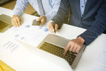 Business concept. Business people discussing the charts and graphs showing the results of their successful teamwork. financial plan.の写真素材