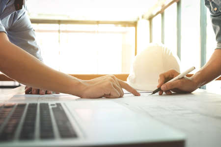 Image of engineer or architectural project, Close up of Architects engineer's hands drawing plan on...