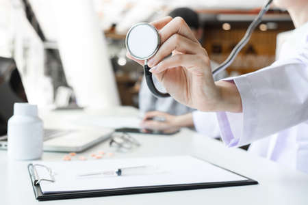 Close up of stethoscope in hand, palm of a doctor cardiologist. Medicine, health hospital equipment for health care, treatment, Healthcare and Medical conceptの写真素材