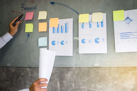 Business executive making presentation to colleagues in office, during meeting, explaining, consultation.の写真素材