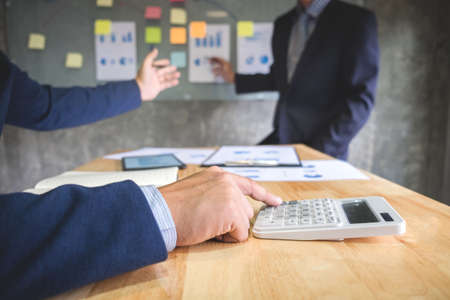 Two colleague excultive conference presentating report of new plan marketing to development consultating business in company, using digital tablet.の写真素材