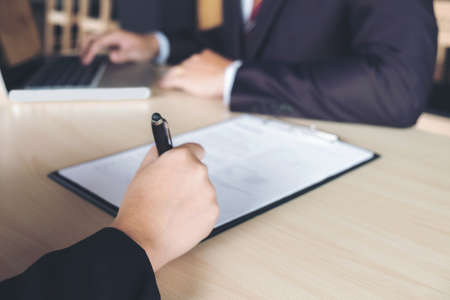 Closeup of woman applicant writing application form, person completing filling information.