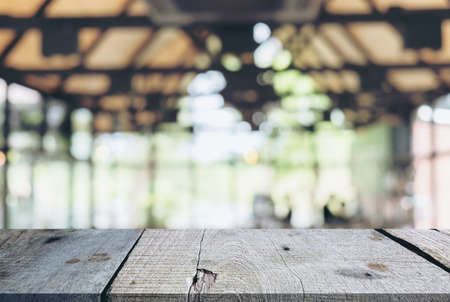 Image of Selected focus empty wooden table and Coffee shop or blurred cafe background of abstract with bokeh image. for montage or display your products.の写真素材