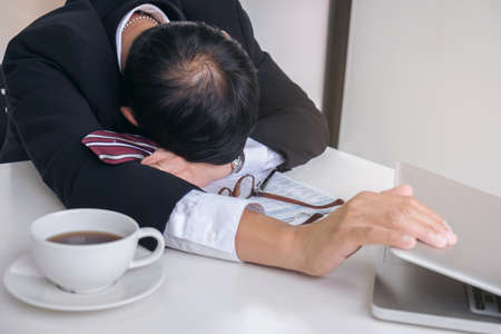 Feeling sick and tired, businessman frustrated and stress to resignation.の写真素材