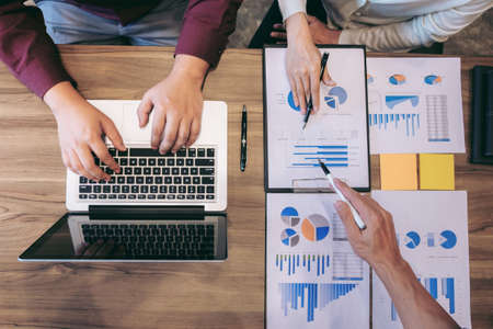 Startup business people group meeting, Young creative coworkers team working and discussing new plan project in office, entrepreneurs, brainstorming, Teamwork, analyze plans, professional investor.のeditorial素材