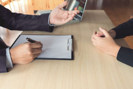 Job interview, Young attractive executives man asking questions to applicant about work history, colloquy dream,  Skill, expertise, experience and businessman listen to candidate answers.の写真素材
