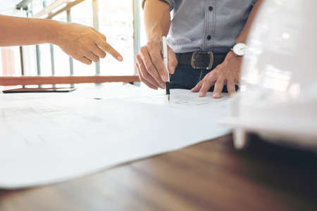 Image of engineer or architectural project, Close up of hands architects engineering working on...