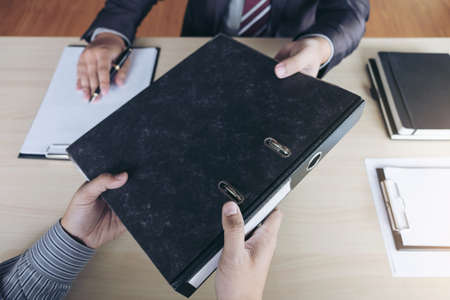 Job interview, Young attractive executives man asking questions to applicant about work history, colloquy dream,  Skill, expertise, experience and businessman listen to candidate answers.の写真素材