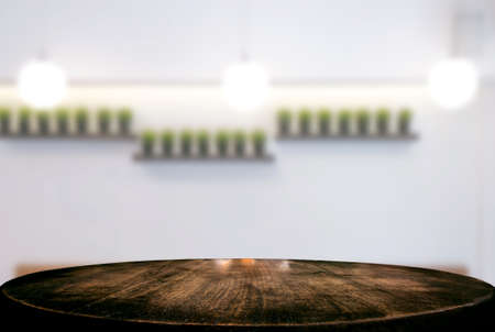 Image of Selected focus empty wooden table and Coffee shop or blurred cafe background of abstract with bokeh image. for montage or display your products.の写真素材
