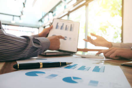 Business team meeting working with new startup project, discussion and analysis data the charts and...