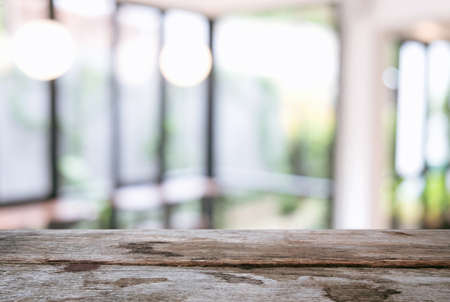 Image of Selected focus empty wooden table and Coffee shop or blurred cafe background of abstract with bokeh image. for montage or display your products.の写真素材