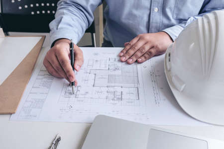 Engineering or Creative architect in construction project, Engineers hands working on construction...