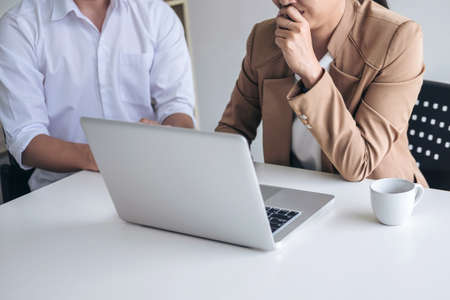 Business team meeting working with new startup project, discussion and analysis data on laptop,  Business finance and accounting concept.の写真素材