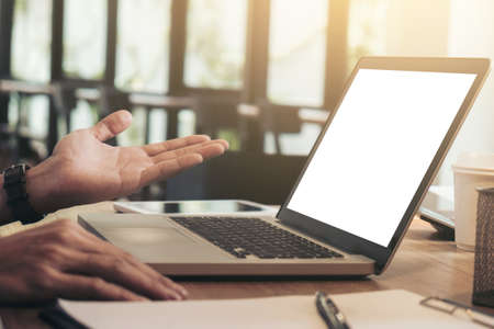 Business man working analyzing data in office, Image of confident executive analysis new financial project plan to investment with laptop and digital tablet on wooden desk in living room.の写真素材